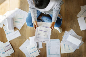 The top view of Woman managing the debt paper at New Westminster ,BC