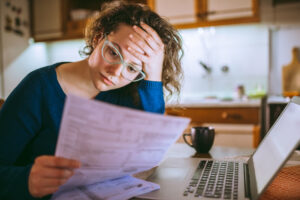 The lady reading the document in home at New Westminster, BC